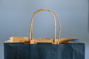 blue and brown tote bag - does putting all of your business in shopify work well?