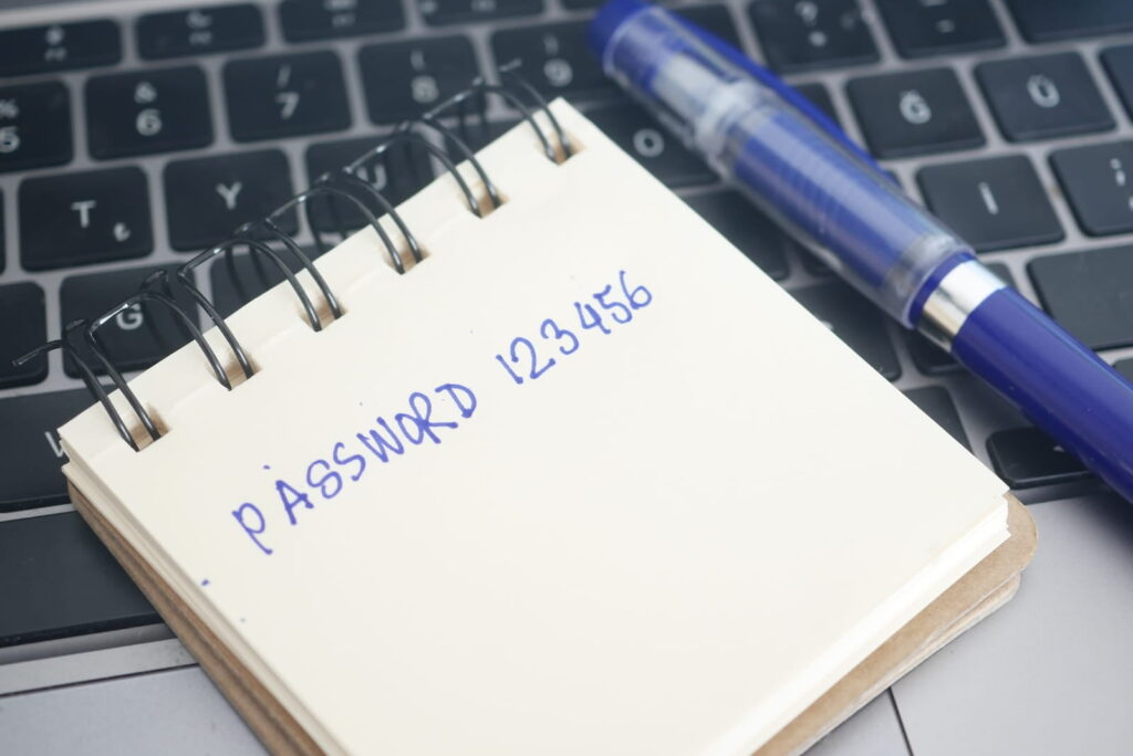 Notepad with Password 123456 written on notepad demonstrating poor password security